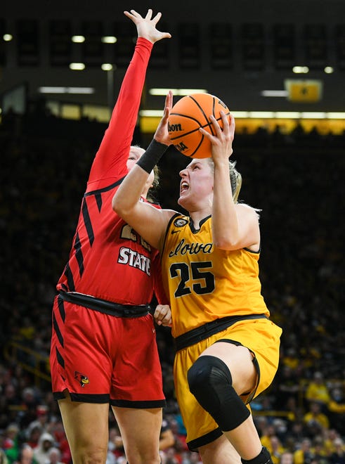 Iowa's forward Monika Czinano (25) goes up for a shot against Illinois State's forward Chloe Van Zeeland (22) during the opening round of the Women's NCAA Basketball Tournament at Carver-Hawkeye Arena Friday, March 18, 2022, in Iowa City.