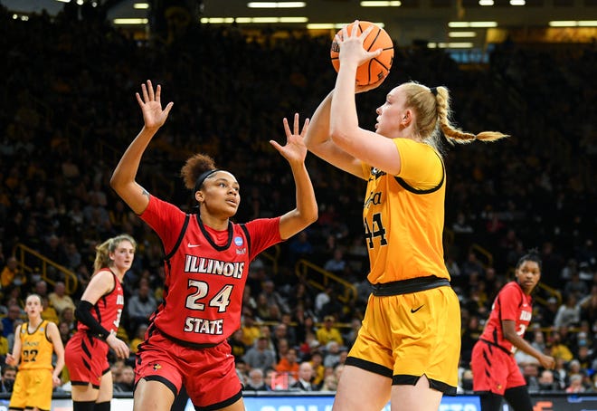 Iowa's forward Addison O'Grady (44) goes up for a shot against Illinois State's forward DeAnna Wilson (24) during the opening round of the Women's NCAA Basketball Tournament at Carver-Hawkeye Arena Friday, March 18, 2022, in Iowa City.