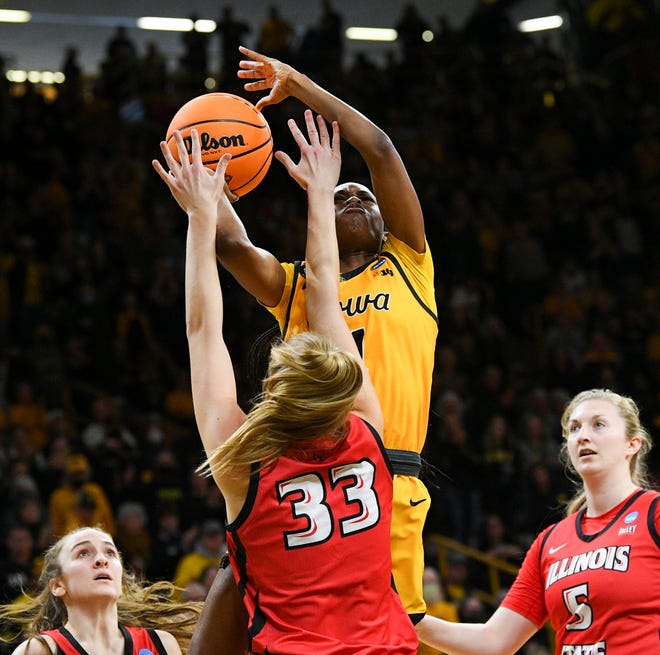 Iowa's guard Tomi Taiwo (1) goes up for a shot against Illinois State's forward Hannah Kelle (33) during the opening round of the Women's NCAA Basketball Tournament at Carver-Hawkeye Arena Friday, March 18, 2022, in Iowa City.