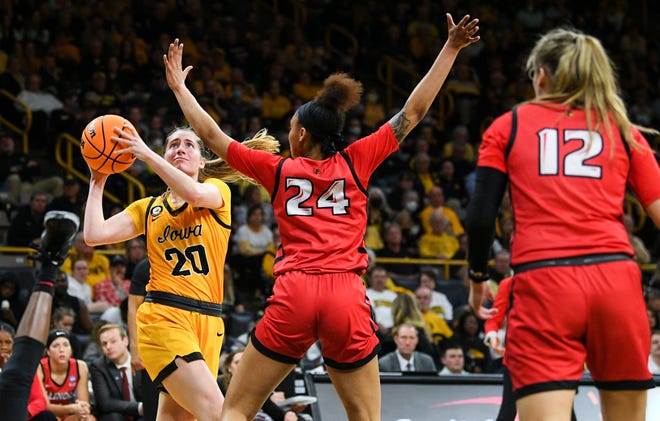 Iowa's guard Kate Martin (20) goes up for a shot against Illinois State's forward DeAnna Wilson (24) during the opening round of the Women's NCAA Basketball Tournament at Carver-Hawkeye Arena Friday, March 18, 2022, in Iowa City.