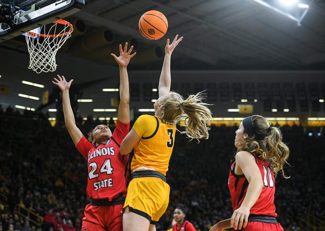 Iowa's guard Sydney Affolter (3) goes up for a shot against Illinois State's forward DeAnna Wilson (24) during the opening round of the Women's NCAA Basketball Tournament at Carver-Hawkeye Arena Friday, March 18, 2022, in Iowa City.