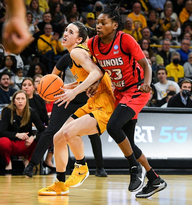 Iowa's guard Caitlin Clark (22) drives to the basket against Illinois State's guard Juliunn Redmond (23) during the opening round of the Women's NCAA Basketball Tournament at Carver-Hawkeye Arena Friday, March 18, 2022, in Iowa City.