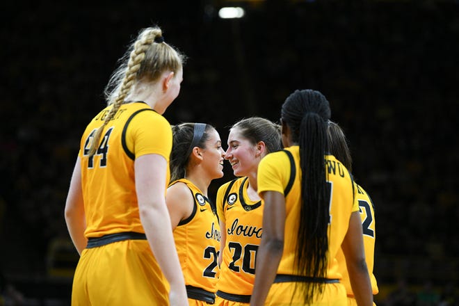 Iowa players celebrate a foul called against Illinois State during the opening round of the Women's NCAA Basketball Tournament at Carver-Hawkeye Arena Friday, March 18, 2022, in Iowa City.