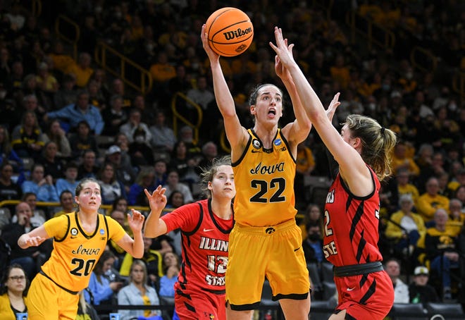 Iowa's guard Caitlin Clark (22) goes up for a shot against Illinois State's forward Kate Bullman (32) during the opening round of the Women's NCAA Basketball Tournament at Carver-Hawkeye Arena Friday, March 18, 2022, in Iowa City.