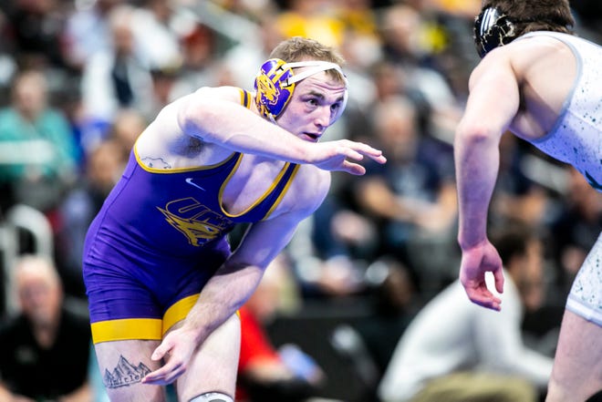 Northern Iowa's Parker Keckeisen, left,Êwrestles Cal Poly's Bernie Truax at 184 pounds for third place during the fifth session of the NCAA Division I Wrestling Championships, Saturday, March 19, 2022, at Little Caesars Arena in Detroit, Mich.