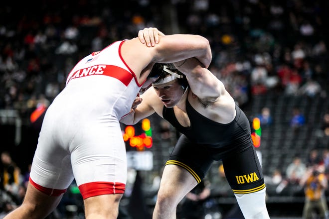 Iowa's Tony Cassioppi, right, wrestles Nebraska's Christian Lance at 285 pounds for seventh place during the fifth session of the NCAA Division I Wrestling Championships, Saturday, March 19, 2022, at Little Caesars Arena in Detroit, Mich.