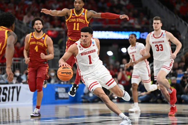 Mar 20, 2022; Milwaukee, WI, USA; Wisconsin Badgers guard Johnny Davis (1) drives to the basket against Iowa State Cyclones guard Tyrese Hunter (11) during the first half during the second round of the 2022 NCAA Tournament at Fiserv Forum. Mandatory Credit: Benny Sieu-USA TODAY Sports