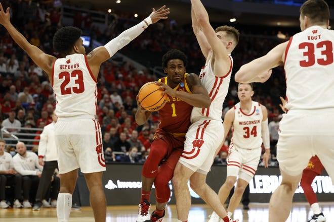 Mar 20, 2022; Milwaukee, WI, USA; Iowa State Cyclones guard Izaiah Brockington (1) against Wisconsin Badgers center Chris Vogt (33) during the first half drives to the basket against  during the second round of the 2022 NCAA Tournament at Fiserv Forum. Mandatory Credit: Jeff Hanisch-USA TODAY Sports