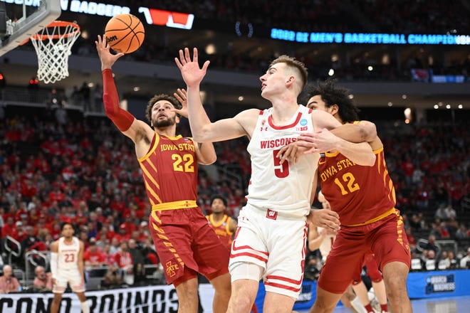 Mar 20, 2022; Milwaukee, WI, USA; Iowa State Cyclones guard Gabe Kalscheur (22) loses control of the ball against Wisconsin Badgers forward Tyler Wahl (5) during the first half during the second round of the 2022 NCAA Tournament at Fiserv Forum. Mandatory Credit: Benny Sieu-USA TODAY Sports