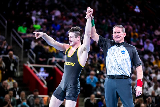 Missouri's Keegan O'Toole celebrates after scoring a decision against Stanford's Shane Griffith at 165 pounds in the finals during the sixth session of the NCAA Division I Wrestling Championships, Saturday, March 19, 2022, at Little Caesars Arena in Detroit, Mich.