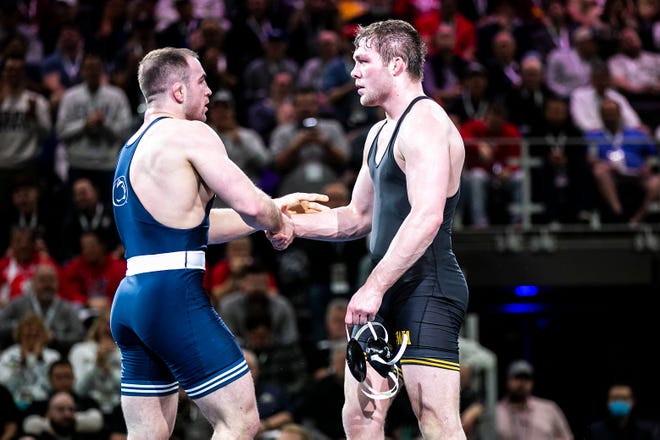 Iowa's Jacob Warner, right, shakes hands with Penn State's Max Dean at 197 pounds in the finals during the sixth session of the NCAA Division I Wrestling Championships, Saturday, March 19, 2022, at Little Caesars Arena in Detroit, Mich.