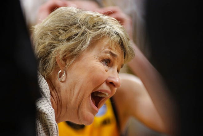 Iowa head coach Lisa Bluder talks to her players in a huddle during the second half of a second-round game against Creighton in the NCAA w omen's college basketball tournament, Sunday, March 20, 2022, in Iowa City, Iowa. (AP Photo/Ron Johnson)
