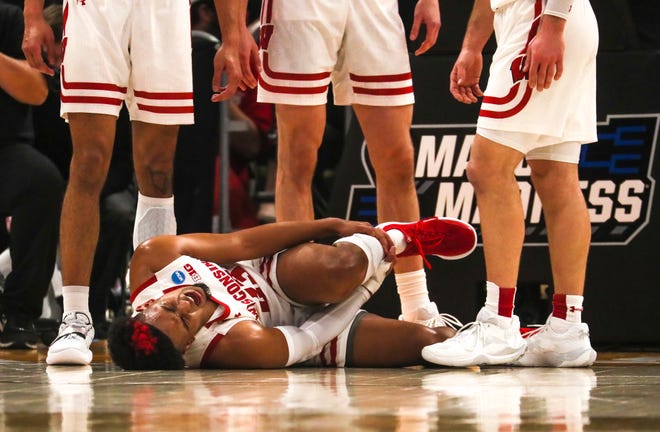 Wisconsin Badgers guard Chucky Hepburn (23) is hurt during the first half of their game against Iowa State in 2022 NCAA Division I Men's Basketball Tournament game Sunday, March 20, 2022, at Fiserv Forum in Milwaukee.