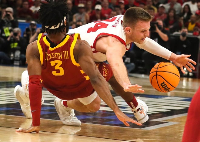 Wisconsin Badgers guard Brad Davison (34) is fouled by Iowa State Cyclones guard Tre Jackson (3) during the first half of their 2022 NCAA Division I Men's Basketball Tournament game Sunday, March 20, 2022, at Fiserv Forum in Milwaukee.

Mjs Mjs 03202022 Ncaa 21 Ec06572