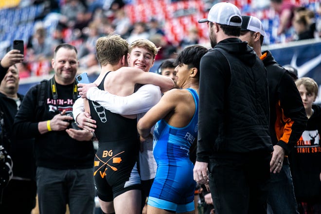 Kane Naaktgeboren celebrates with Cale Seaton, center, after scoring a decision against Joseph Toscano at 138 pounds in the 16U finals during the USA Wrestling High School National Recruiting Showcase, Saturday, April 2, 2022, at the UNI-Dome in Cedar Falls, Iowa.