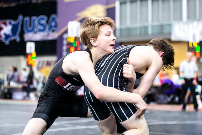 Jayden Rinken, left, wrestles Brady Byrd at 100 pounds in the open finals during the USA Wrestling High School National Recruiting Showcase, Saturday, April 2, 2022, at the UNI-Dome in Cedar Falls, Iowa.