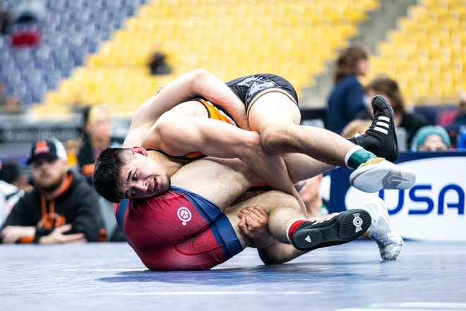 Hunter Garvin, right, wrestles Garrett Willuweit at 152 pounds in the finals during the USA Wrestling High School National Recruiting Showcase, Saturday, April 2, 2022, at the UNI-Dome in Cedar Falls, Iowa.