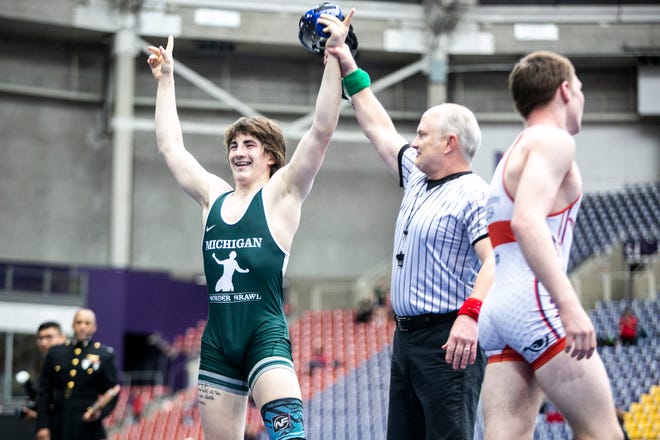 Max Magayna, left, has his hand raised after scoring a fall at 160 pounds in the finals during the USA Wrestling High School National Recruiting Showcase, Saturday, April 2, 2022, at the UNI-Dome in Cedar Falls, Iowa.