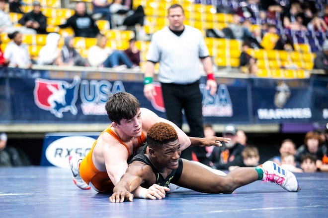Wyatt Voelker, top, wrestles Melvin Whitehead at 195 pounds in the finals during the USA Wrestling High School National Recruiting Showcase, Saturday, April 2, 2022, at the UNI-Dome in Cedar Falls, Iowa.