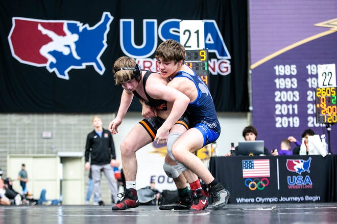 Cale Seaton, left, wrestles Blake Cosby at 126 pounds in the 16U finals during the USA Wrestling High School National Recruiting Showcase, Saturday, April 2, 2022, at the UNI-Dome in Cedar Falls, Iowa.