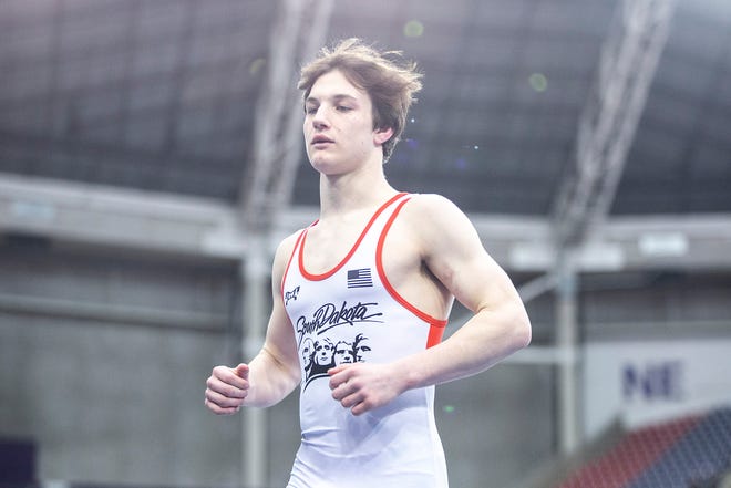 Owen Hansen is introduced before wrestling at 126 pounds in the finals during the USA Wrestling High School National Recruiting Showcase, Saturday, April 2, 2022, at the UNI-Dome in Cedar Falls, Iowa.