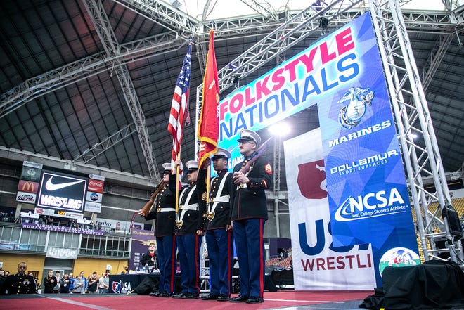 The American flag is presented before the national anthem is performed in the finals during the USA Wrestling High School Recruiting Showcase, Saturday, April 2, 2022, at the UNI-Dome in Cedar Falls, Iowa.