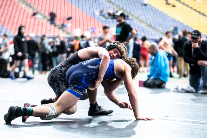 Cale Seaton, top, wrestles Blake Cosby at 126 pounds in the 16U finals during the USA Wrestling High School National Recruiting Showcase, Saturday, April 2, 2022, at the UNI-Dome in Cedar Falls, Iowa.