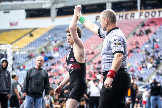 Garret Rinken has his hand raised after scoring a decision at 120 pounds in the open finals during the USA Wrestling High School National Recruiting Showcase, Saturday, April 2, 2022, at the UNI-Dome in Cedar Falls, Iowa.