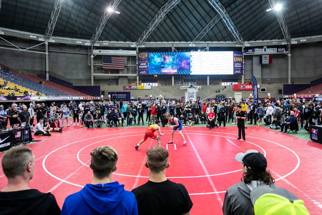 Ian Parker, left, wrestles Seth Gross during the USA Wrestling Folkstyle Nationals, Saturday, April 2, 2022, at the UNI-Dome in Cedar Falls, Iowa.