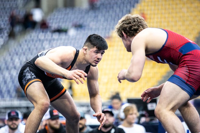 Hunter Garvin, left, wrestles Garrett Willuweit at 152 pounds in the finals during the USA Wrestling High School National Recruiting Showcase, Saturday, April 2, 2022, at the UNI-Dome in Cedar Falls, Iowa.