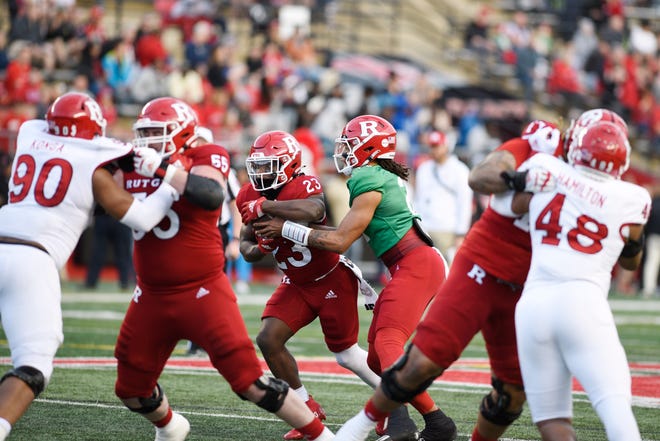 Rutgers football Scarlet-White Game at SHI Stadium on Friday, April 22, 2022. S #2 QB Gavin Wimsatt hands-off to #23 Wesley Bailey.