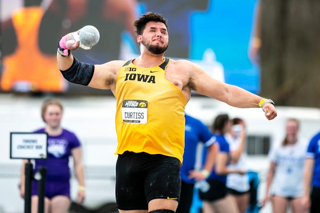 Iowa's Nik Curtiss competes in shot put during the Musco Twilight NCAA outdoor track and field meet, Saturday, April 23, 2022, at Francis X. Cretzmeyer Track in Iowa City, Iowa. The throw set a school record, 20.04m. Curtiss finished second in the event.