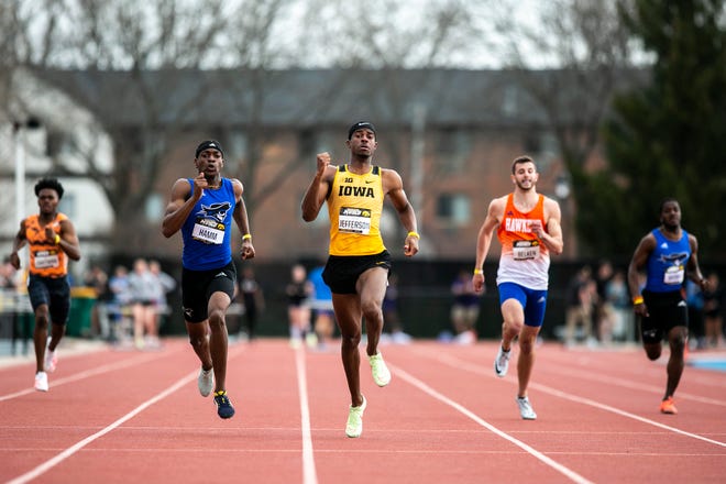 Iowa's Khullen Jefferson, center, competes in the 400 meter during the Musco Twilight NCAA outdoor track and field meet, Saturday, April 23, 2022, at Francis X. Cretzmeyer Track in Iowa City, Iowa.