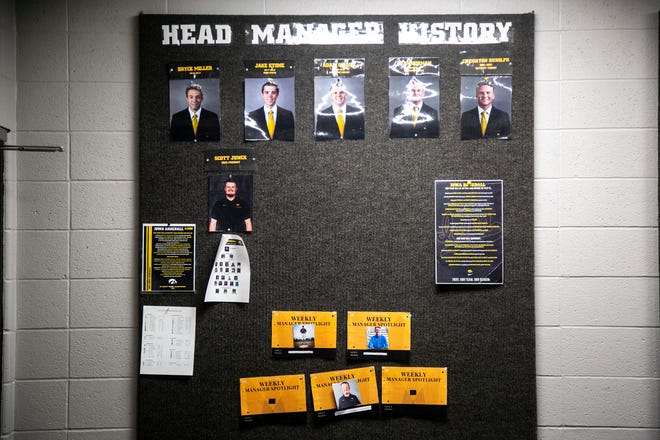Photos of former Iowa baseball head managers is seen, Friday, May 20, 2022, at the Jacobson Athletic Building in Iowa City, Iowa.