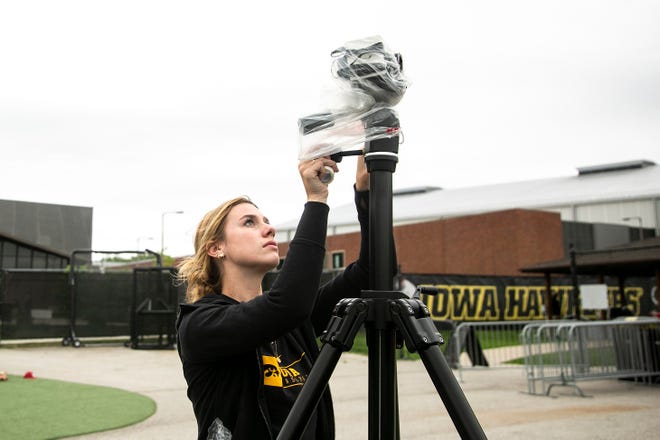 Iowa baseball manager Bailey Raso sets up a video camera before a NCAA Big Ten Conference baseball game against Indiana, Friday, May 20, 2022, at Duane Banks Field in Iowa City, Iowa.