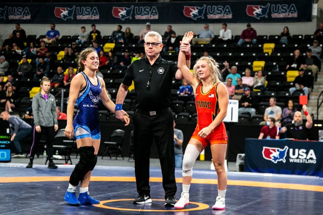 Felicity Taylor, right, has her hand raised after scoring a fall against Haley Franich at 53 kg during the third session of the USA Wrestling World Team Trials Challenge Tournament, Sunday, May 22, 2022, at Xtream Arena in Coralville, Iowa.