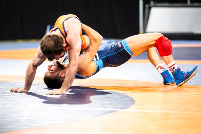 Vito Arujau, bottom, wrestles Jakob Camacho at 57 kg during the second session of the USA Wrestling World Team Trials Challenge Tournament, Saturday, May 21, 2022, at Xtream Arena in Coralville, Iowa.