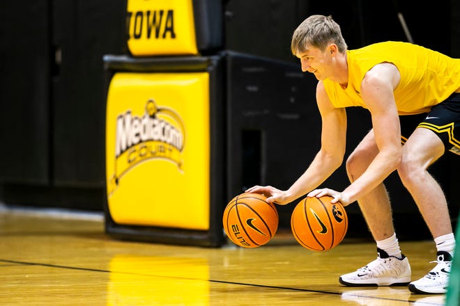 Iowa's Josh Dix warms up before a NCAA men's basketball summer practice, Wednesday, June 15, 2022, at Carver-Hawkeye Arena in Iowa City, Iowa.