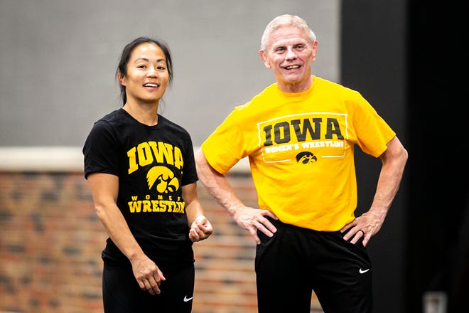 Iowa women's wrestling head coach Clarissa Chun, left, and associate head coach Gary Mayabb watch during a girls wrestling technique camp, Wednesday, July 6, 2022, at the GreenState Family Fieldhouse in Coralville, Iowa.