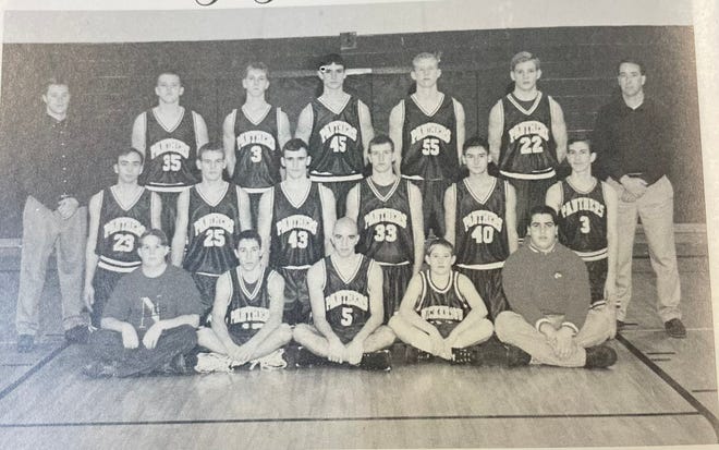 The Nickerson Panthers boys basketball team takes its yearbook picture for the 1997-1998 school year.