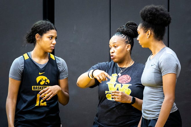 Iowa assistant coach Raina Harmon, center, talks with freshman forwards Jada Gyamfi, left, and Hannah Stuelke during a summer NCAA women's basketball practice, Friday, July 29, 2022, at Carver-Hawkeye Arena in Iowa City, Iowa.