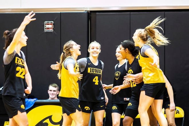 Iowa guard Kate Martin, second from left, celebrates with teammates after making a 3-point basket during a summer NCAA women's basketball practice, Friday, July 29, 2022, at Carver-Hawkeye Arena in Iowa City, Iowa.