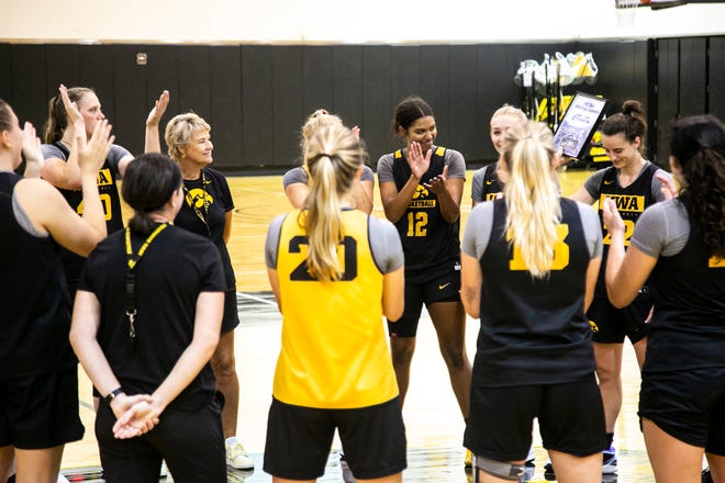 Iowa guard Caitlin Clark, right, gets acknowledged by teammates after receiving an award during a summer NCAA women's basketball practice, Friday, July 29, 2022, at Carver-Hawkeye Arena in Iowa City, Iowa.
