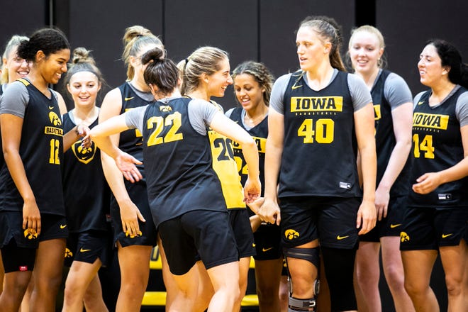 Iowa guard Kate Martin gets embraced by teammates after making a 3-point basket during a summer NCAA women's basketball practice, Friday, July 29, 2022, at Carver-Hawkeye Arena in Iowa City, Iowa.