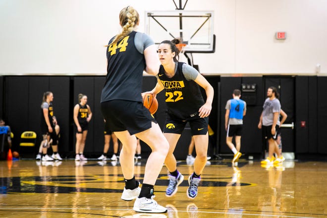 Iowa guard Caitlin Clark, right, takes the ball up court during a summer NCAA women's basketball practice, Friday, July 29, 2022, at Carver-Hawkeye Arena in Iowa City, Iowa.