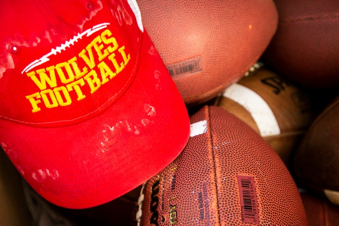 A Marion Wolves hat is seen during a high school football practice, Monday, Aug. 8, 2022, at Marion High School in Marion, Iowa.