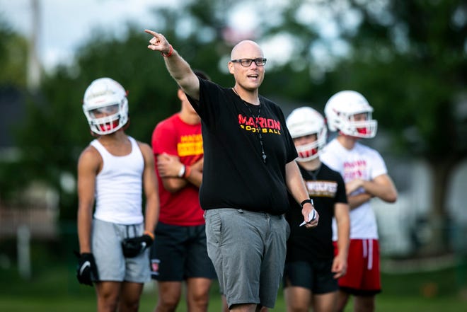 Marion head coach Michael Joyner gives instructions during a high school football practice, Monday, Aug. 8, 2022, at Marion High School in Marion, Iowa.