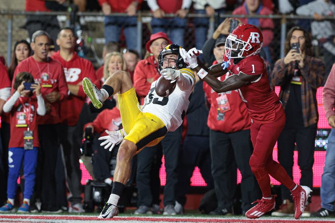 Sep 24, 2022; Piscataway, New Jersey, USA; Iowa Hawkeyes defensive back Riley Moss (33) breaks up a pass in the end zone intended for Rutgers Scarlet Knights wide receiver Aron Cruickshank (1) during the first half at SHI Stadium. Mandatory Credit: Vincent Carchietta-USA TODAY Sports