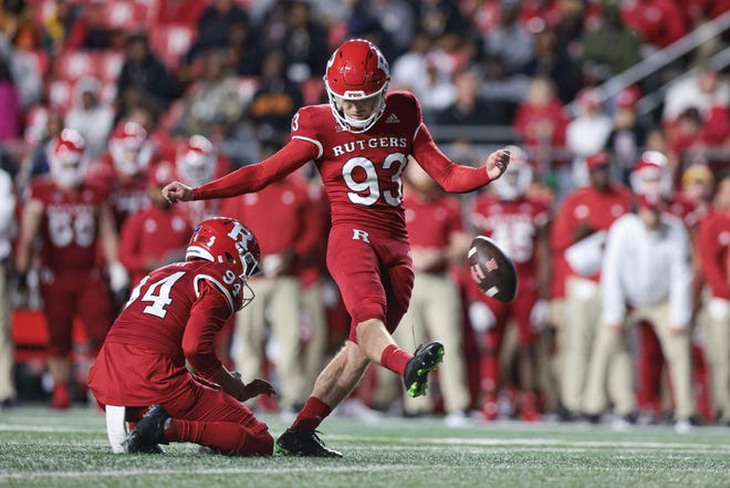Sep 24, 2022; Piscataway, New Jersey, USA; Rutgers Scarlet Knights place kicker Jude McAtamney (93) kicks a field goal as punter Adam Korsak (94) holds during the first half against the Iowa Hawkeyes at SHI Stadium. Mandatory Credit: Vincent Carchietta-USA TODAY Sports