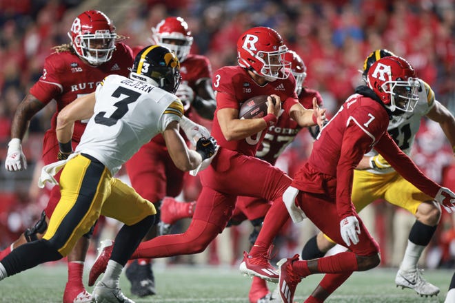 Sep 24, 2022; Piscataway, New Jersey, USA; Rutgers Scarlet Knights quarterback Evan Simon (3) carries the ball as Iowa Hawkeyes defensive back Cooper DeJean (3) pursues during the first half at SHI Stadium. Mandatory Credit: Vincent Carchietta-USA TODAY Sports